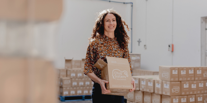 Chloe Van Dyke holding a box of chia sister products