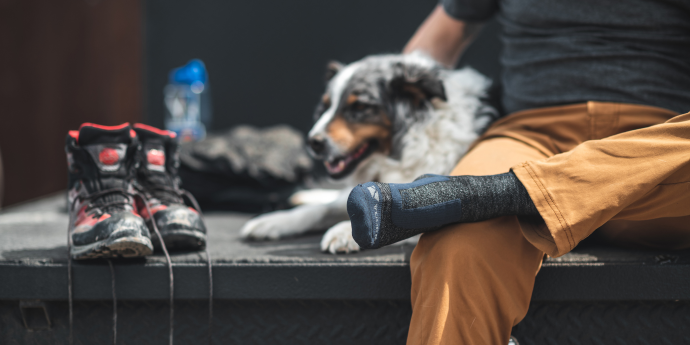 person sitting with dog